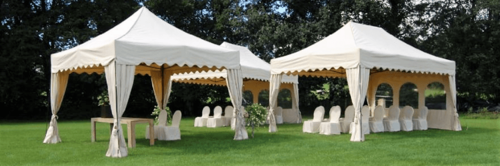 Royal Folding Tent – Ecru in colour with scalloped roof and elegant corner curtains in rural wedding setting