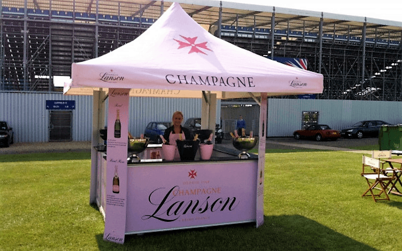 4-sided pavilion kiosk fully branded with Lanson Champagne on both the roof and base panels