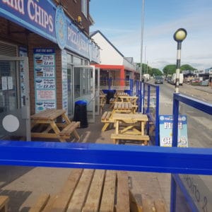 Outdoor Chippy Restaurant Terrace defined using Gibli Terrace Screens branded company logo and to blend with the overall street appeal
